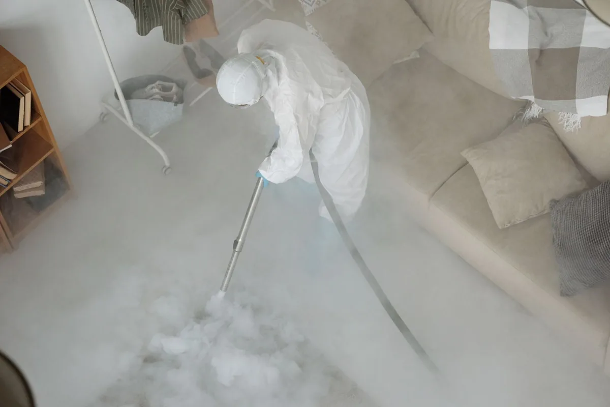 Biohazard cleanup technician in protective equipment, Kane, PA